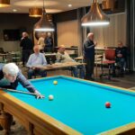 Biljartclub SWOL start 2026 met een biljart-minitriatlon, pub-quiz en darten